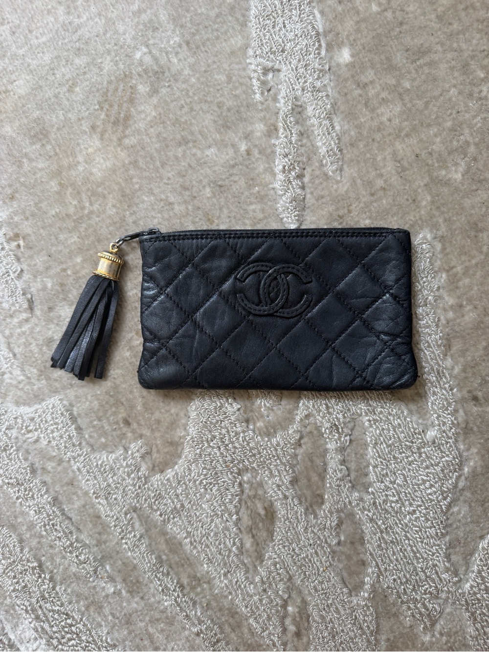 CHANEL Black Quilted Leather Tassel Zip Clutch